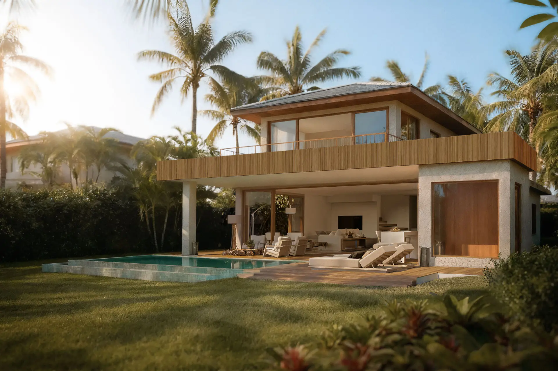 Azul House A seen from the garden, with a pool and sun through the palm trees