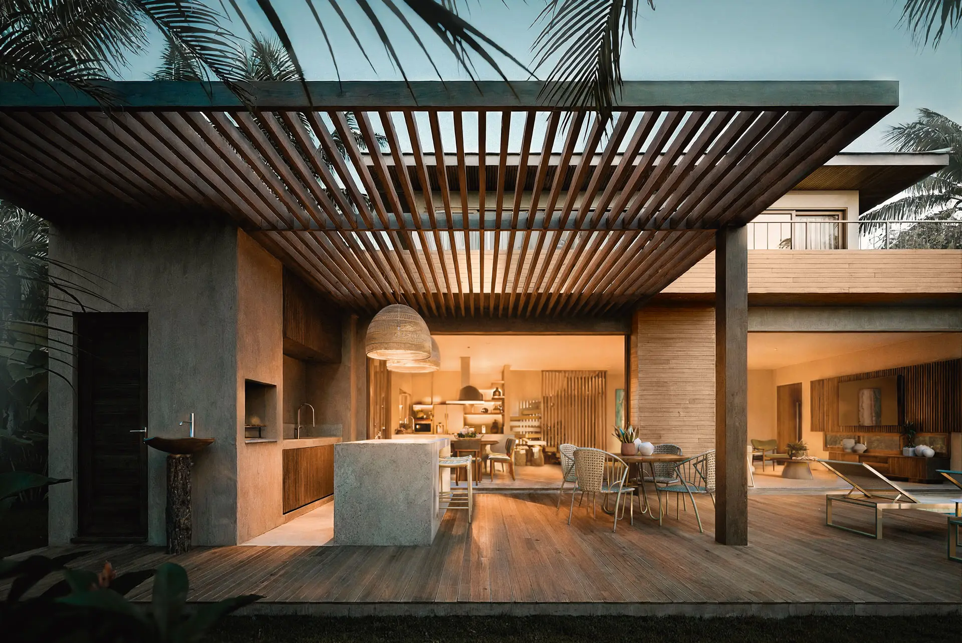 Azul House B veranda under a wooden pergola, kitchen behind
