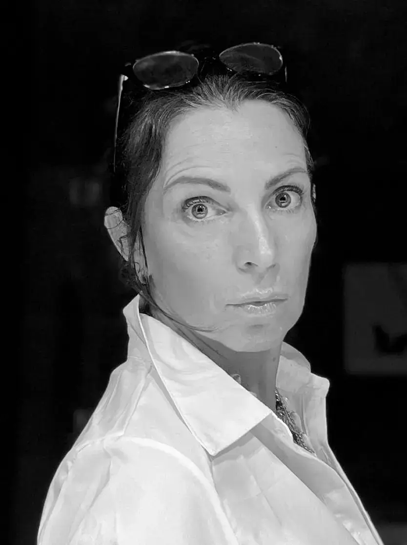 Sara Romano Afonso, in a white shirt, black-and-white portrait
