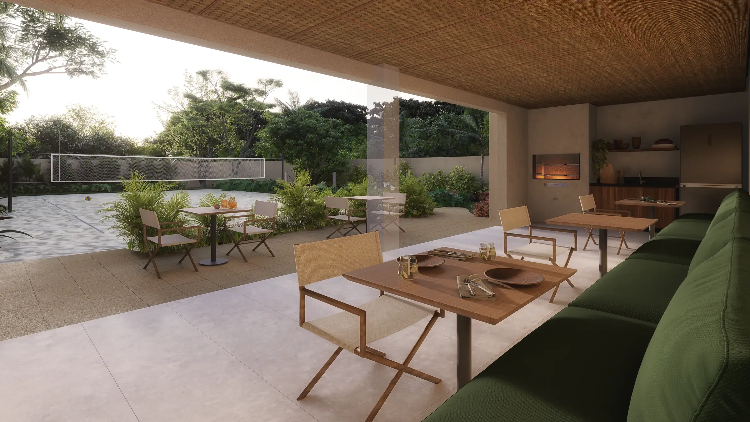 Outdoor dining area with wooden tables and chairs with green cushions, ceramic flooring, a planted garden and a gourmet area with a barbecue.