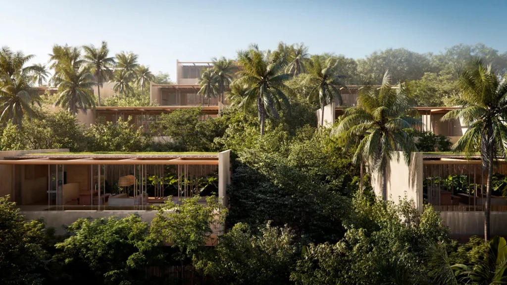 Casas de praia de alto padrão em Trancoso e Arraial d'Ajuda integram-se ao cenário tropical, cercadas por vegetação exuberante e palmeiras sob céu azul.